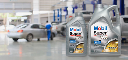 Mobil Super™ 3000 Formula V 5W-30 on a bench in a workshop
