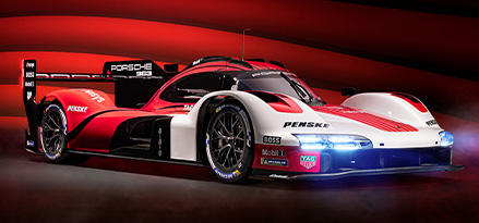 The latest Porsche 963 LMDH with a red and white livery
