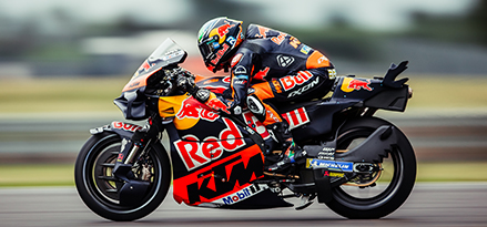 Motorcyclist on a Red Bull motorbike on a track