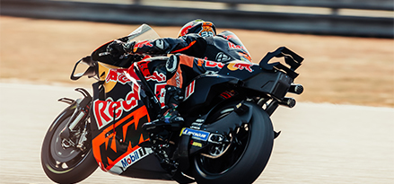 Red Bull motorcyclist racing on a track