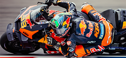 Red Bull motorcyclist going round a corner on a Red Bull motorbike