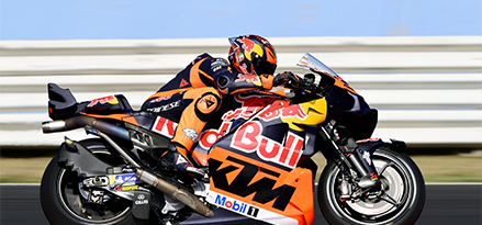 Red Bull motorbike racing along the track
