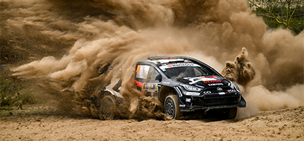 Toyota racing car turning and causing dust cloud