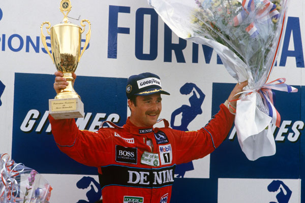 Nigel Mansell holding a trophy at Belgium Grand Prix in 1986
